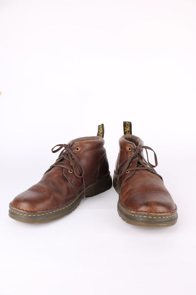 Dr. Martens 'Lea' chukka style brown mulled leather, lace up boots. Features signature yellow weltDr. Martens 'Lea' chukka style brown mulled leather, lace up boots. Features signature yellow welt