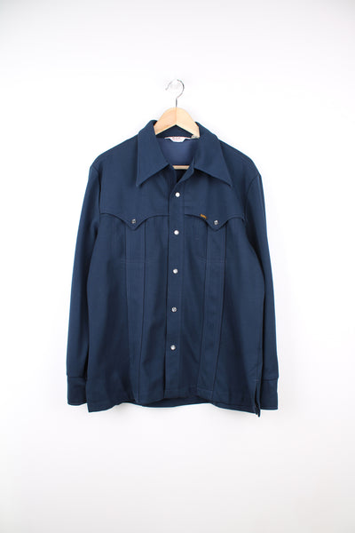 Vintage Lee Rider blue leisure shirt/ lightweight jacket. Features tab logo on the pocket, western style yoke and dagger collar. good condition Size in Label: Label Faded - Measures like a mens M 