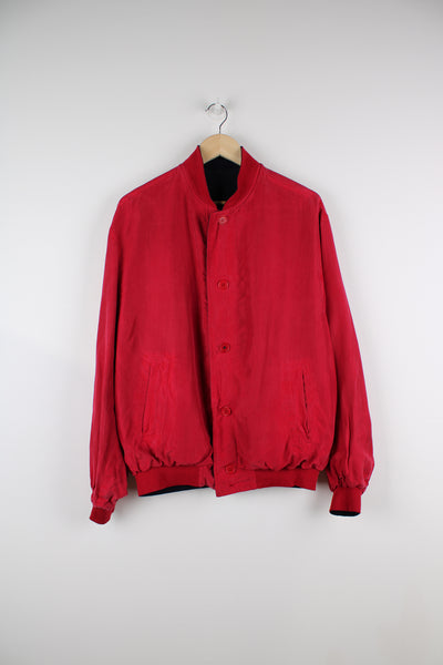 Paul & Shark reversible lightweight jacket. Silk bomber jacket in navy and red, closes with buttons down the front. Has embroidered logo on the navy blue side.   good condition - light marks on the red side (see photos).   Size in label:  No Size  - Measures like a mens L