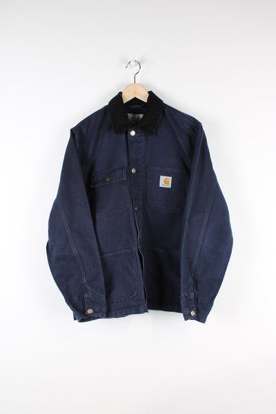 Carhartt WIP Michigan chore jacket in navy blue features patch logo on the chest and corduroy collar