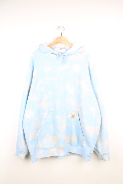Carhartt Hoodie in a blue and white colourway, cloud style design throughout, puff print spell out on the chest and has the logo embroidered on the pocket.