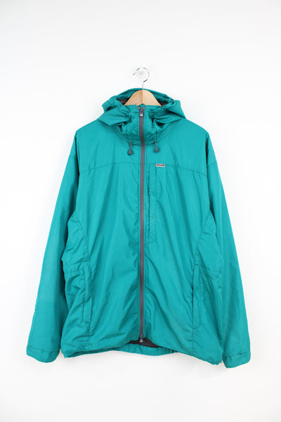 Teal blue Paramo Helki zip through outdoor jacket with badge on the sleeve and hood