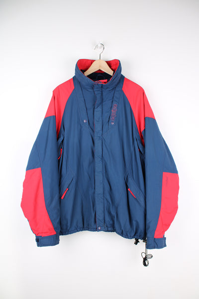 Vintage Helly Hansen Tech jacket in a blue and pink colourway, zip up, multiple pockets, insulated and has logo embroidered on the front.