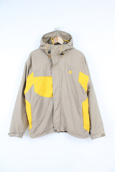 Nike Storm Fit ACG zip through tan and yellow outdoor jacket with zip in fleece,  multiple pockets and hood