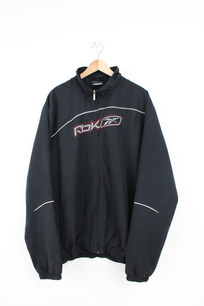 All black Reebok tracksuit jacket with embroidered logo across the chest 