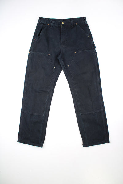 Carhartt Double Knee Jeans in a black colourway, multiple pockets, and has the logo embroidered on the back pocket.