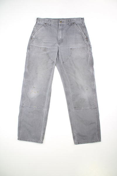 Carhartt Double Knee Jeans in a grey colourway, multiple pockets, and has the logo embroidered on the back pocket.