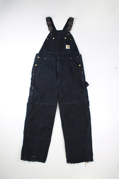 Vintage Carhartt black denim dungarees with double knee reinforcement.  good condition - Rips and bleach marks to the cuffs (see photos)Size in Label: No Size Label - Measures like a Mens M