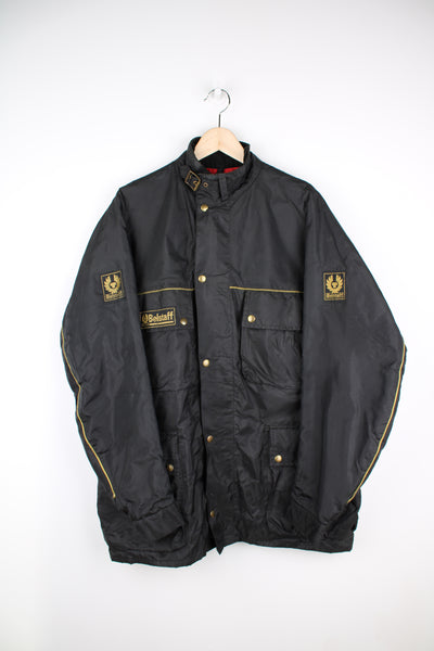 Belstaff Trialmaster 500 black nylon jacket. Closes with popper buttons.  good condition- the inside of the pockets have started to flake and the fabric has bubbled slightly on the front near the popper buttons (see images)  Size in Label:  No Size - Measures like a Mens L