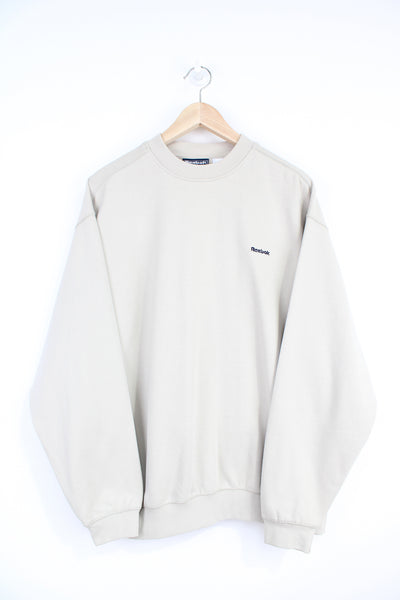 Off white / cream Reebok crewneck sweatshirt with embroidered spell-out logo on the chest