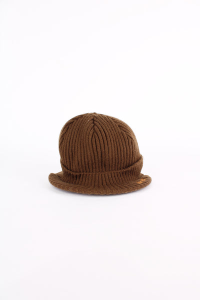 Timberland beanie cap in brown, features orange embroidered logo on the peak and on the back, one size.