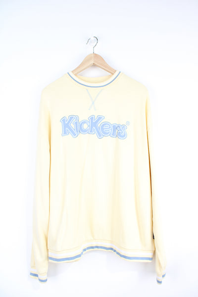 Kickers pastel yellow crewneck sweatshirt, with baby blue embroidered spell out logo across the chest