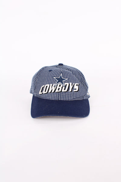 Vintage 90's Dallas Cowboys NFL Pro Line cap by Logo Athletic, features embroidered spell-out logo on the front and adjustable strap at the back.