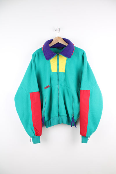 Vintage Columbia Wizbang Fleece in a green, red, yellow and purple colourway, zip up, side pockets, big collar and has the logo embroidered on the front.