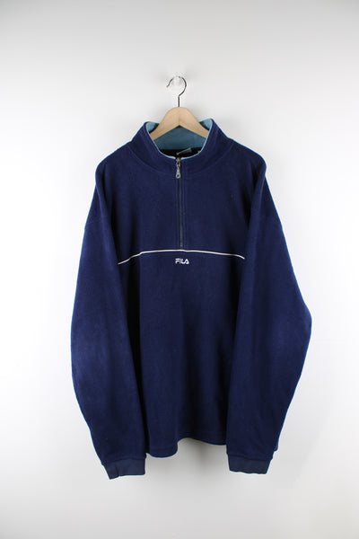 Navy blue Fila 1/4 zip fleece with embroidered logo on the chest and white piping