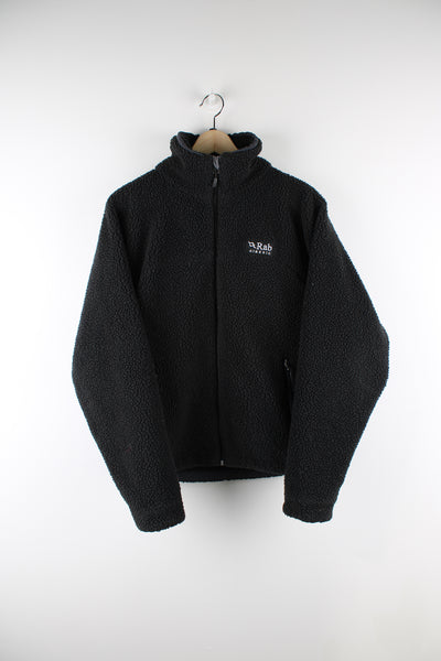 Rab Classic sherpa style zip through fleece in black. features embroidered logo on the chest and zip up double pockets