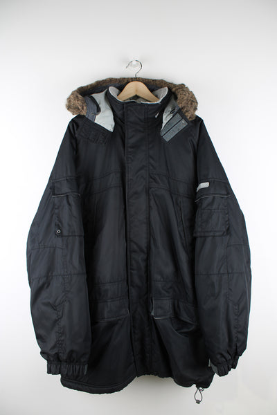 Vintage Nike Parka Coat in black, zip up, multiple pockets, detachable hood, fleece lining, and has swoosh logo embroidered on the front and back. 