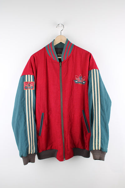 Vintage 80's Adidas, Liverpool football team reversible bomber jacket, red and green or grey and green colourway options, multiple pockets, and has logos embroidered throughout the jacket. 