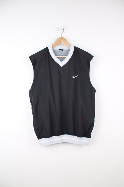 Nike Lightweight Training Vest in a black and grey colourway, v neck, mesh lining, and has the swoosh logo embroidered on the front.