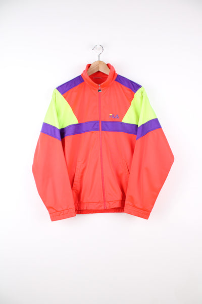 Fila Tracksuit Jacket in a neon orange, green and purple colourway, zip up, side pockets, and has the logo embroidered on the front.