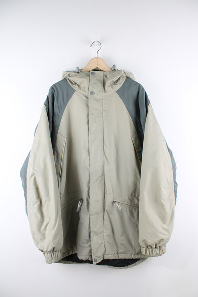 Vintage Fila outdoors waterproof jacket in a 2 tone grey colourway, zip up, multiple pockets, hooded, insulated and has logo embroidered on the front and back.