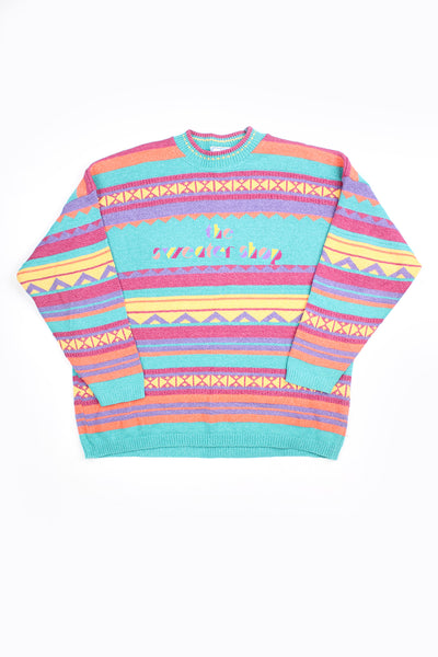 Vintage The Sweater Shop blue, yellow and purple patterned knit jumper, features embroidered spell-out logo across the chest 