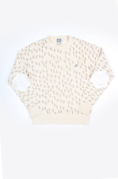 Y2K Nike cream with brown weave crew neck wool jumper, features embroidered swoosh logo on the chest and white elbow pads