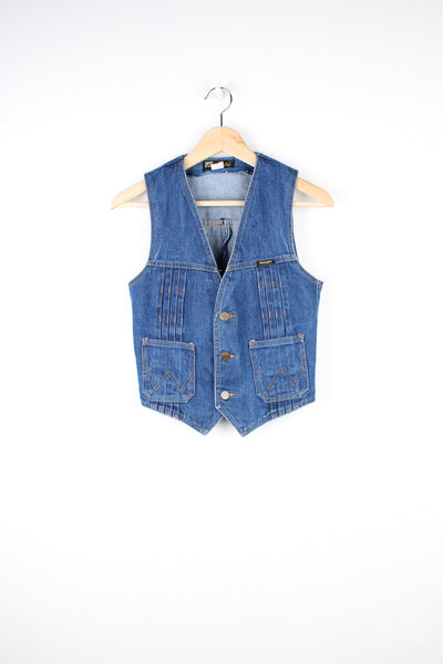 Vintage 1970's Wrangler denim vest in blue, button up with two pockets on the front, embroidered logo on the chest and triple pleats