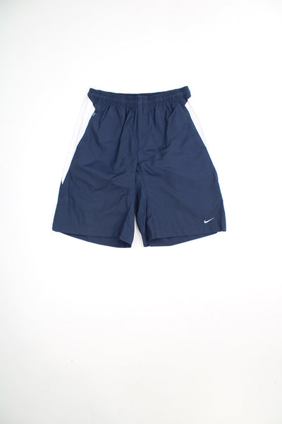 Navy blue Nike shorts with embroidered logo on the leg and embroidered swoosh on the leg. good condition Size in Label: Womens XL 
