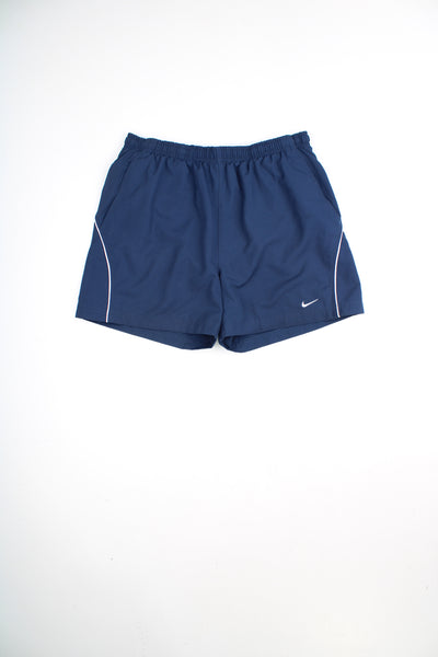 Navy blue Nike sports shorts with embroidered swoosh logo on the leg and elasticated waistband. good condition Size in Label: Mens L