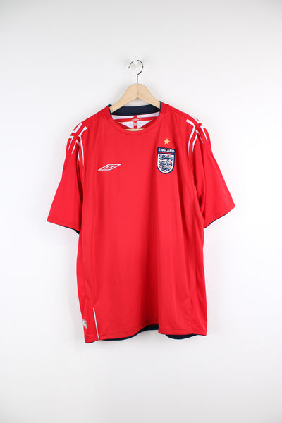 Vintage England 2004/06, Umbro Away Football kit, red colourway, and has embroidered logos on the front. 