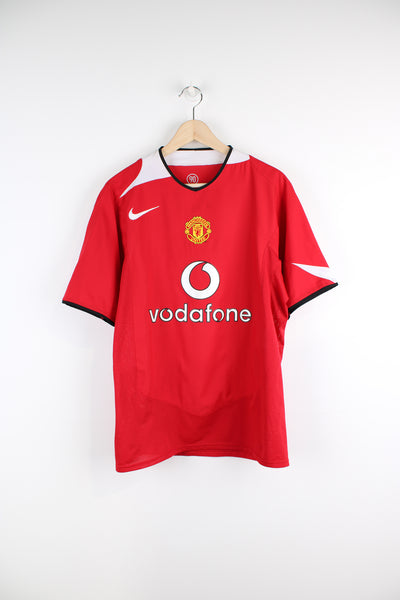 Vintage Manchester United 2004/06, Nike home football shirt, red and white team colourway, v neck, Vodafone sponsor, and has logos embroidered on the front. 