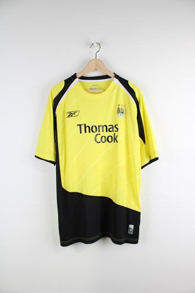 Vintage Manchester City 2005/06, Reebok Third kit football shirt, yellow and black colourway, and has logos printed on the front. 