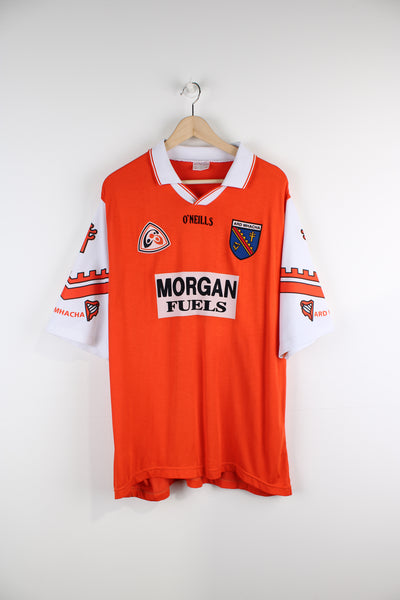 Vintage 1998 Armagh GAA Gaelic Football Shirt, orange and white team colourway, v neck with printed logos on the front and sleeves. 