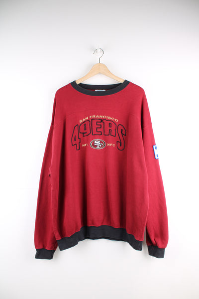 Vintage San Francisco 49ers Sweatshirt in a red and black colourway, team name and logo embroidered on the front.