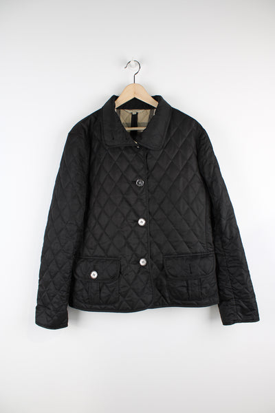Burberry all black button up quilted jacket. Features signature nova check lining, metal hardware and pockets