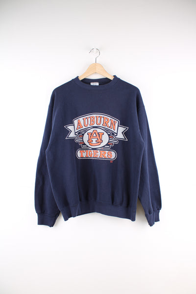 Vintage made in the USA navy blue Auburn Tigers crewneck sweatshirt, features printed spell-out graphic on the front 
