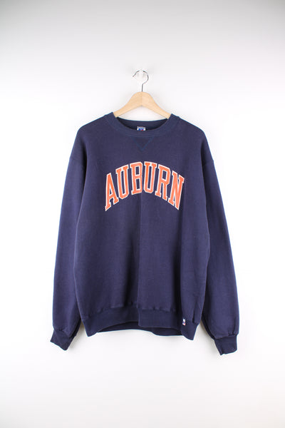 Vintage 90's made in the USA, Auburn University navy blue sweatshirt by Russel Athletic, features printed spell-out across the front 
