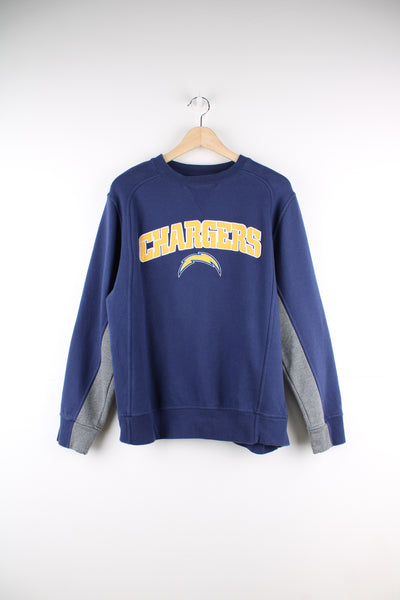 LA Chargers, NFL Pro Line blue crewneck sweatshirt. Features yellow embroidered spell-out details across the chest 