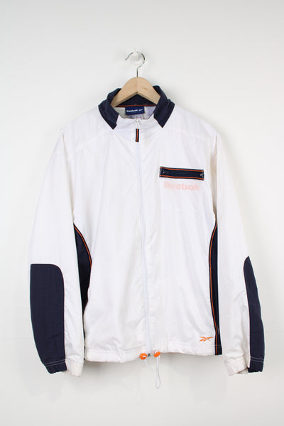 Vintage Reebok white zip through track jacket with logo on the chest and back 