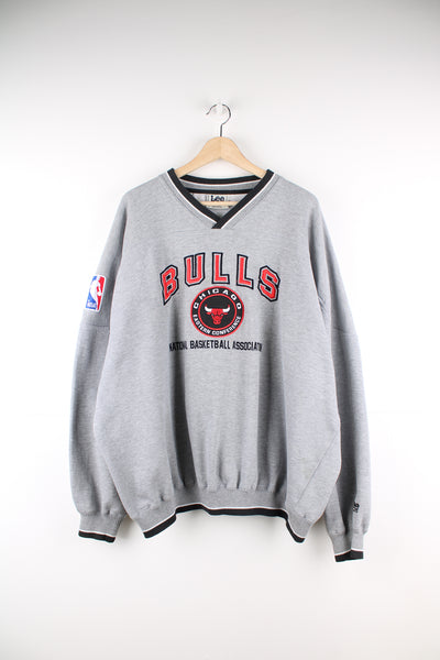 90's Chicago Bulls grey v-neck sweatshirt by Lee Sports, features embroidered spell-out details and badge on the front 