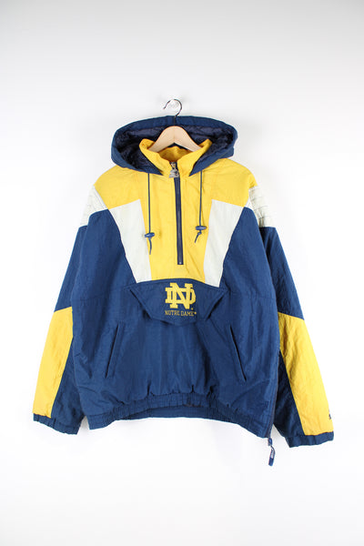 Vintage 90's Notre Dame Fighting Irish Starter Jacket in blue, yellow and white, with embroidered logo on the chest and back.  Good Condition  - white parts are greying and it has a faint mark on the shoulder (see photos)  Size in Label:  M
