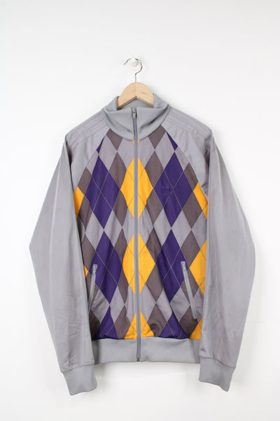 Adidas grey satin tracksuit top with purple and yellow argyle print on the front. Features embroidered spell-out on the chest and full zip
