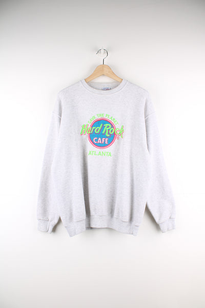 Vintage 90's grey Hard Rock Cafe Atlanta sweatshirt by Santee sweats, features embroidered spell-out motif on the front 
