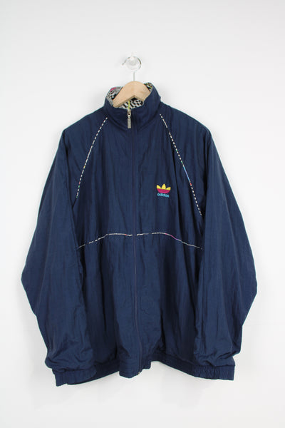 Vintage 90s navy blue Adidas zip through shell jacket with embroidered logo on the chest