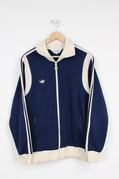 Vintage Adidas navy blue and cream zip through tracksuit top with three stripes down the sleeve