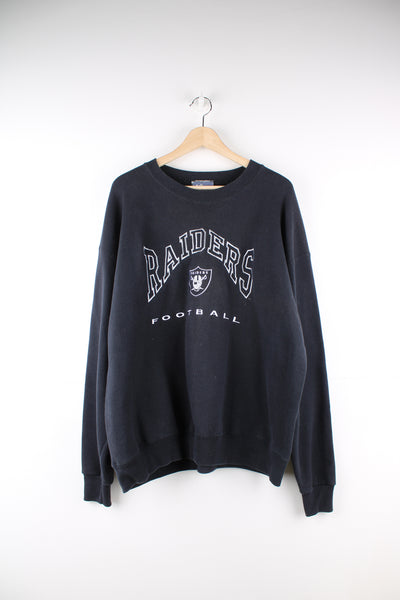 Oakland Raiders black sweatshirt by Lee Sport, features embroidered spell-out details on the front 