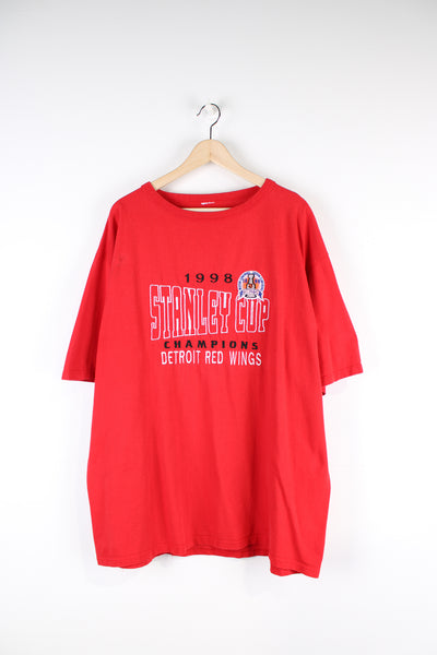 Vintage 1998 Detroit Red Wings Stanley Cup champions t-shirt. Features embroidered design on the front.  good condition - faint mark on the front near the arm and mark on the back near the hem (see photos)  Size in Label:  Label has been removed - Measures like a Mens L