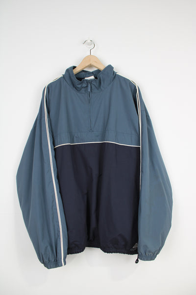 Adidas blue pullover jacket, with embroidered logo near the hem, drawstring waist and 1/4 zip for fastening 