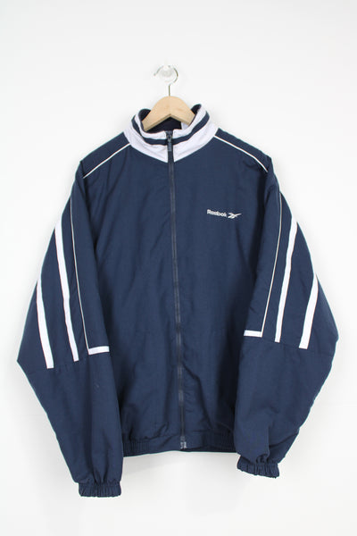 Vintage navy blue Reebok zip through track jacket with embroidered logo on the chest